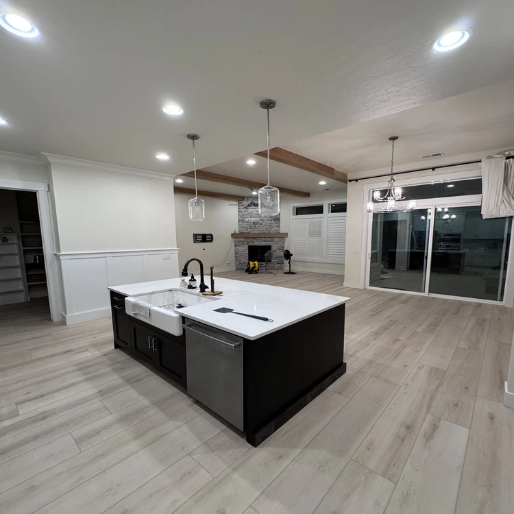 Freshly installed flooring in a remodeled Meridian, ID kitchen by Urban Edge Construction