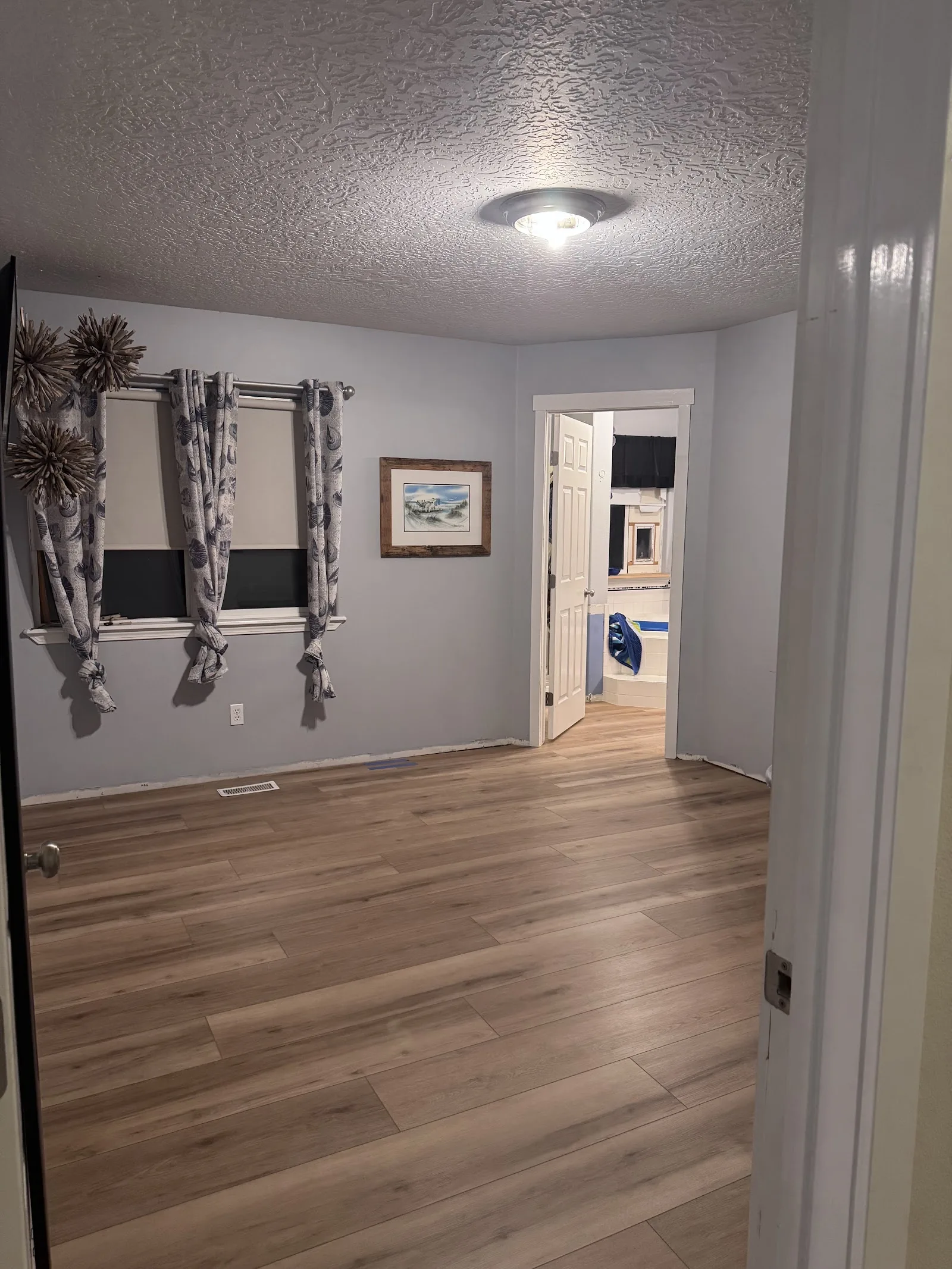 Finished luxury vinyl plank flooring in a living room
