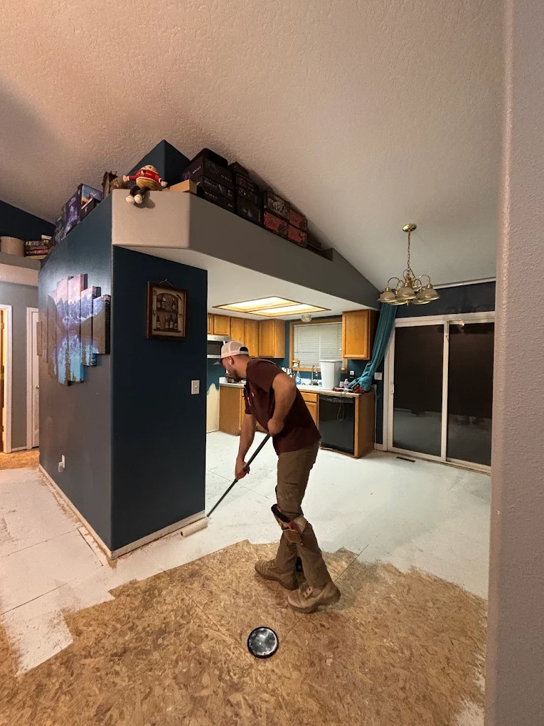 Urban Edge crew member preparing a floor for installation